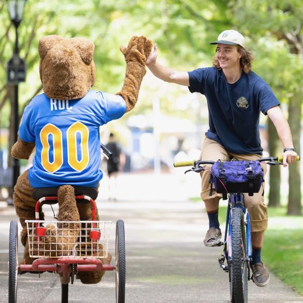 Roc and a student on bicycles