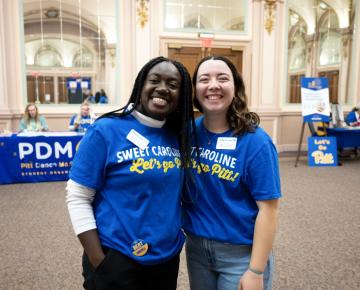 two students in blue and gold